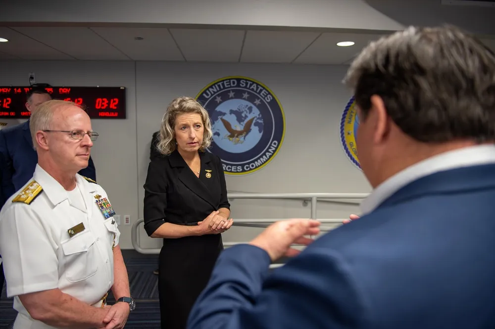 Admiral Caudle and Representative Kiggans tour the operations center interior